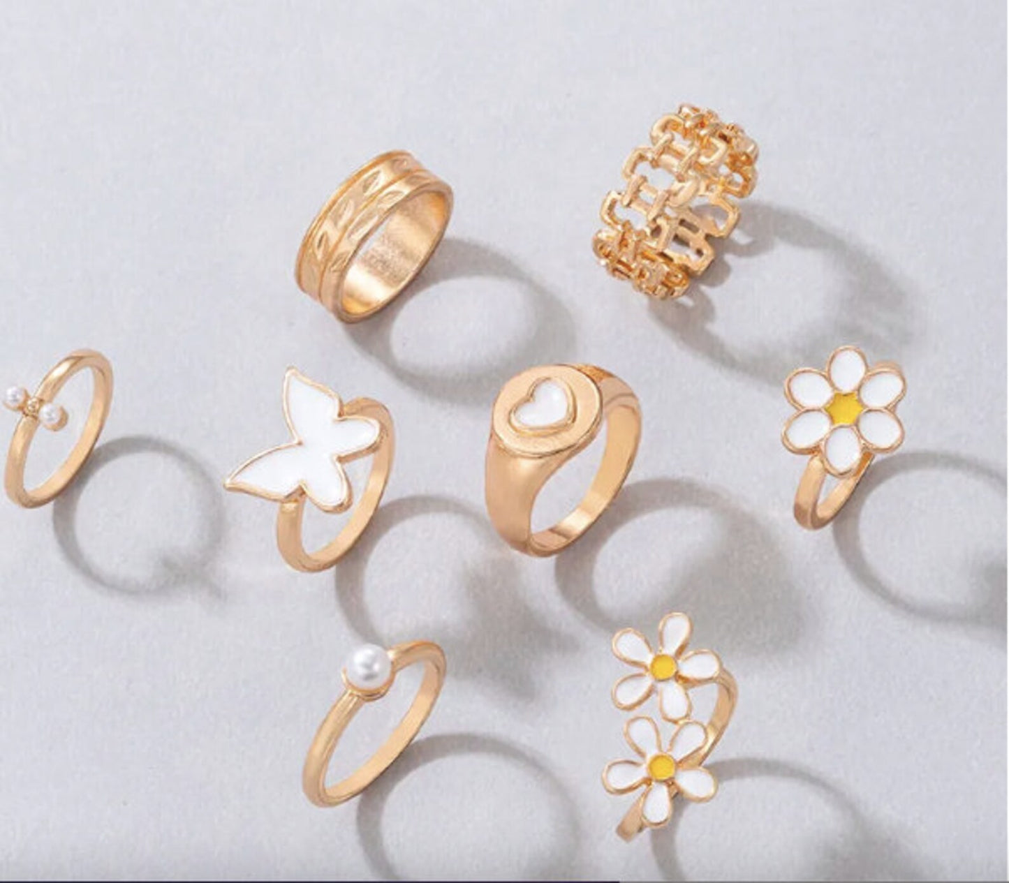 Floral Set of Gold and White Rings